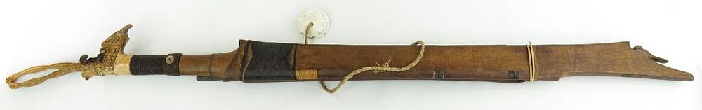 Lot 378: A DAYAK HEADHUNTER MANDAU SWORD