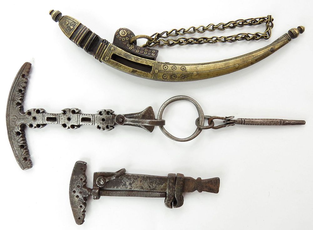 Lot 173: THREE AFGHAN BELT MOUNTS AND TOOLS