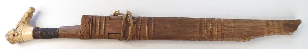 Lot 280: A DAYAK HEADHUNTER MANDAU SWORD