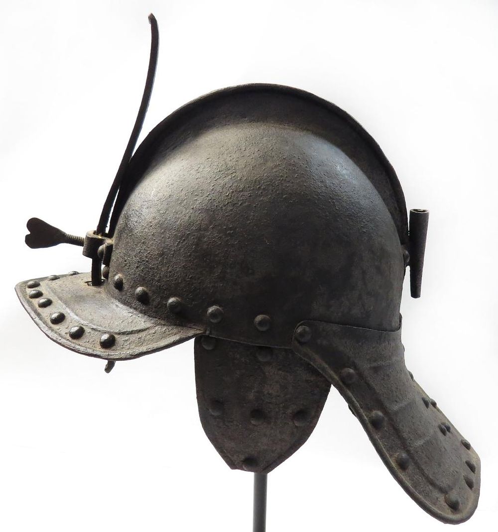 Lot 209: A RARE ENGLISH LOBSTERTAIL HELMET