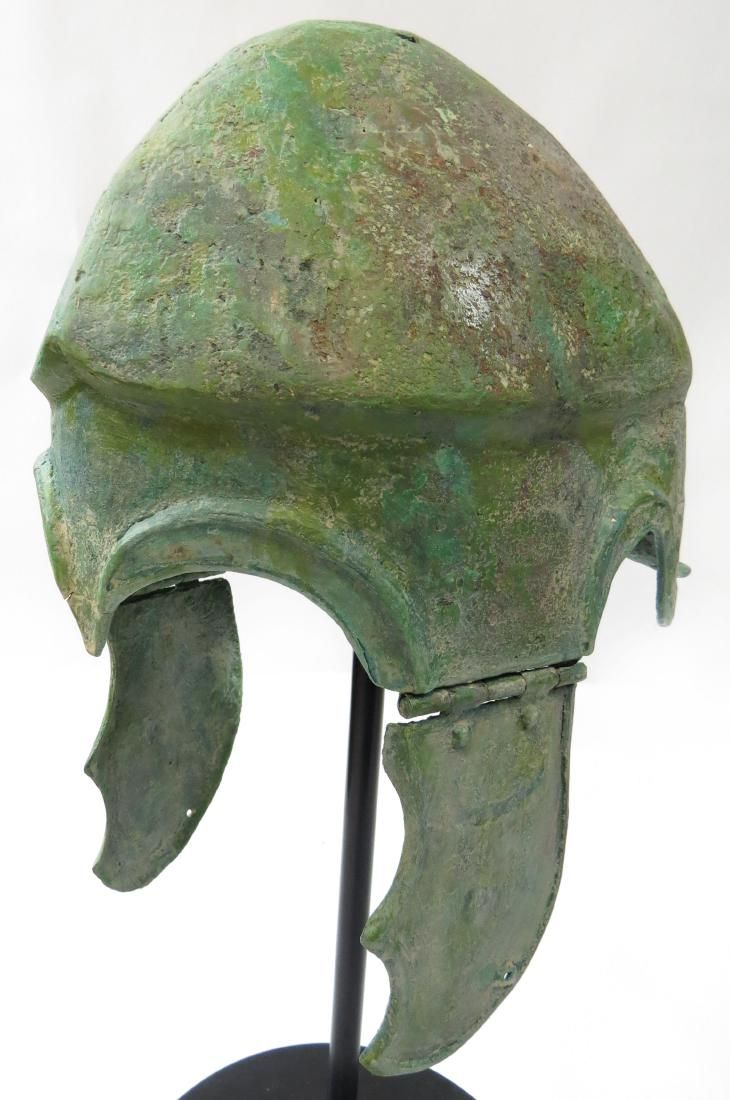 Lot 303: A GREEK BRONZE CHALCIDIAN HELMET