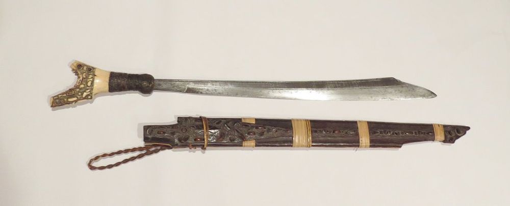 Lot 230: A DAYAK HEADHUNTER MANDAU SWORD