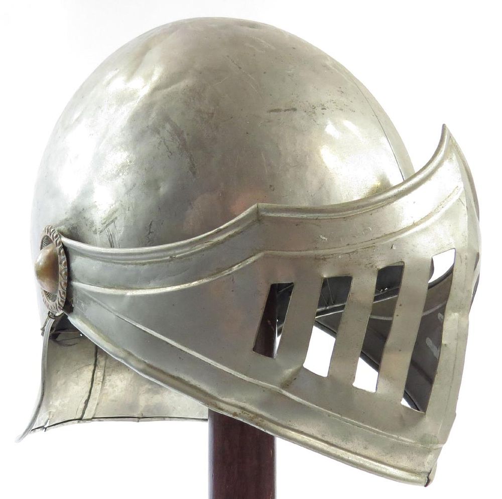 Lot 489: A VICTORIAN-ERA VISORED HELMET