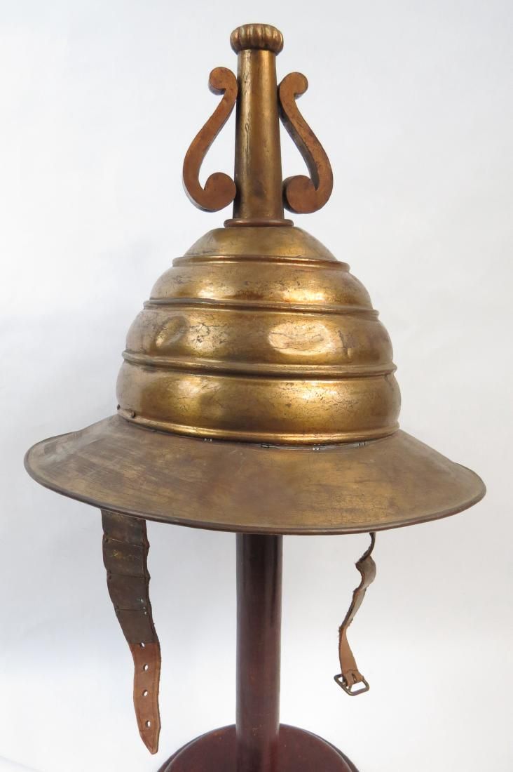 Lot 520: A VICTORIAN-ERA KETTLE HELMET