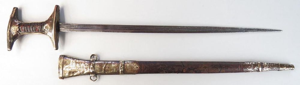 Lot 252: A MOROCCAN GENOUI SWORD