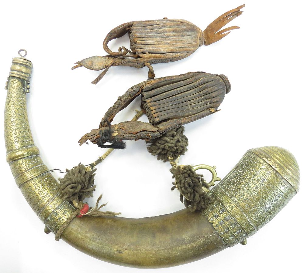 Lot 282: A MOROCCAN POWDERHORN AND BULLET BAGS