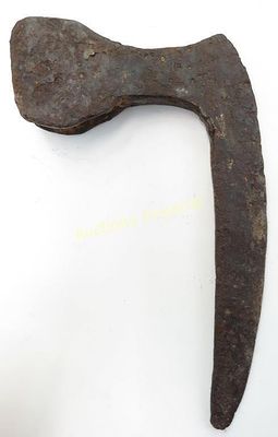 A RARE MEDIEVAL BATTLEAXE HEAD. Excavated, of robust construction, the blade long, narrow and 