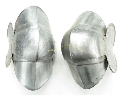 A PAIR OF ARMOR KNEECOPS. Well-wrought of steel with leather straps intact. Early 20th century. 