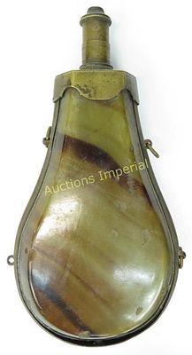 A CONTINENTAL POWDER FLASK. A large example with brass frame and suspension rings with 
