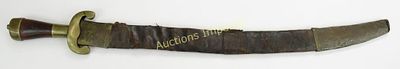 A RARE DAHOMEY AMAZON SWORD. Of characteristic form, the hilt wrought of brass, with polished 