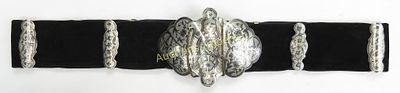 A CAUCASIAN NIELLOED SILVER BELT. The large buckle of characteristic two-piece form, with 