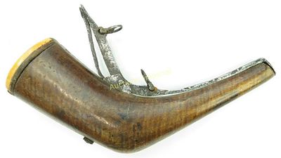 A CAUCASIAN POWDER FLASK. Circassian work, carved of tiger stripe maple with horn and antler 