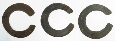 THREE AFRICAN WRIST KNIVES. Kenya, Turkana People, the circular blades well-wrought and edged. 
