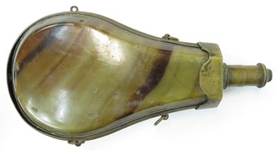 A CONTINENTAL POWDER FLASK. A large example with brass frame and suspension rings with 