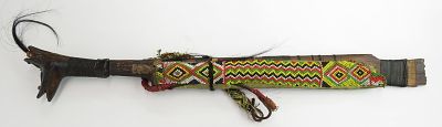 A DAYAK HEADHUNTER PARANG IHLANG OR MANDAU SWORD. The grip of ironwood, finely-carved with aso 