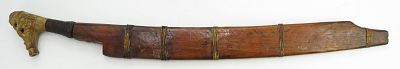 A DAYAK HEADHUNTER PARANG IHLANG OR MANDAU SWORD. The grip of antler, finely-carved with aso 