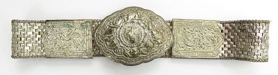 A RARE DAYAK HEADHUNTER BELT. Peranakan work for the Dayak market, finely embossed, engraved and 