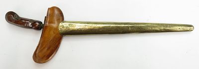 AN INDONESIAN KRIS SWORD. With carved wooden grip and scabbard, the straight blade double-edged 