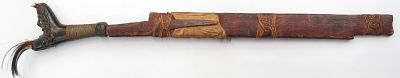A DAYAK HEADHUNTER PARANG IHLANG OR MANDAU SWORD. The grip of antler, finely-carved with aso 