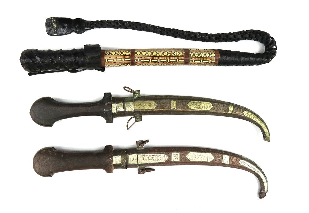 Lot 17: A MOROCCAN RIDING CROP AND TWO KUMYA DAGGERS
