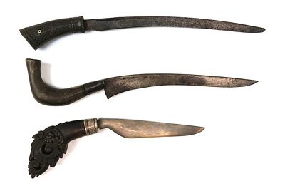 THREE (3) RARE INDONESIAN DAGGERS. Each with well-carved handle of horn, the recurved blades 