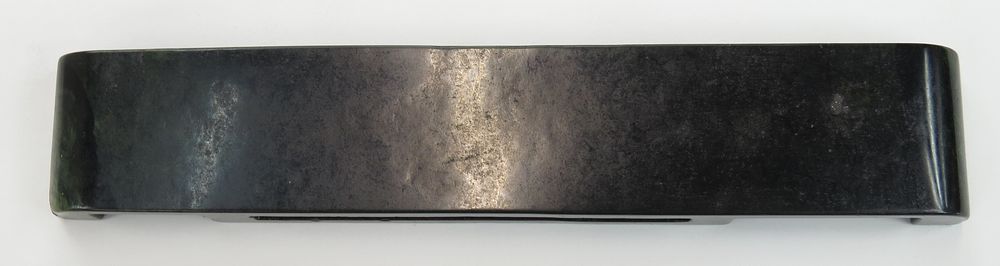 Lot 70: A RARE HAN DYNASTY HARDSTONE SCABBARD SLIDE