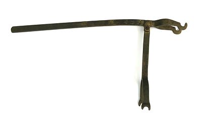 A CROSSBOW SPANNER. Wrought entirely of bronze, of goats foot form, with swiveling latch. 