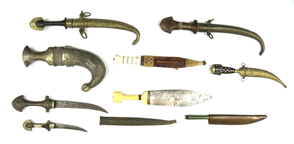 Lot 310: NINE (9) MIDDLE EASTERN DAGGERS AND A SHEATH