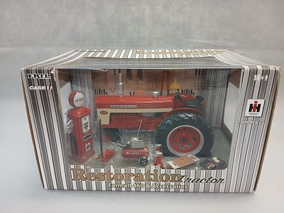 McCormick Farmall 460 Diecast Toy Tractor. 1/16th scale Still in box, includes Mini toys also