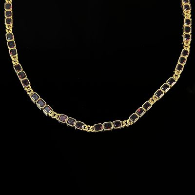 Garnet necklace, 333/8k yellow gold (hallmarked), total weight 16.25g, set with a total of 63 