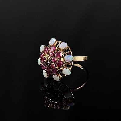 Opal Ring, 585/14K Gelbgold (punziert), Gesamtgewicht 6,3g, besetzt mit geschliffenen roten Steinen