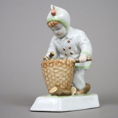 Firewood collector - Zsolnay Pecs, porcelain, glazed and polychrome painted, boy in warm winter 