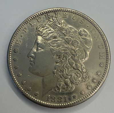 שנה 1881- מטבע אמריקאי אספני מסוג One Dollar בעיצוב העיט האמריקאי, בסגנון Morgan Dollar הקלאסי. 