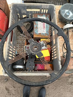 A box of vintage car spares