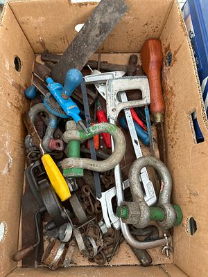 A box of vintage hand tools