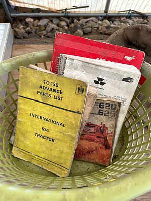 A basket of tractor manuals