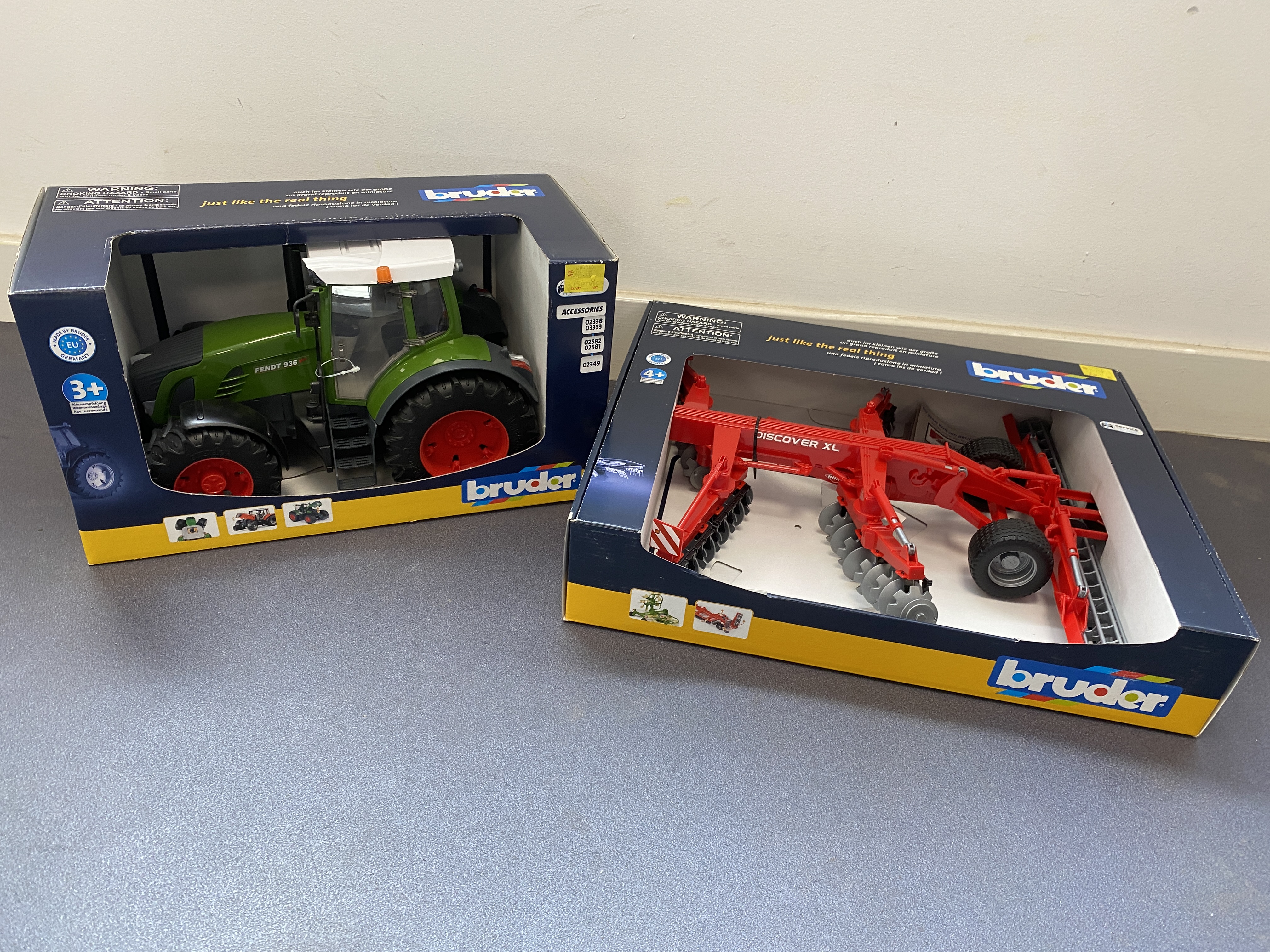 * A Pair of Bruder Toy Farm Vehicles in Original Boxes