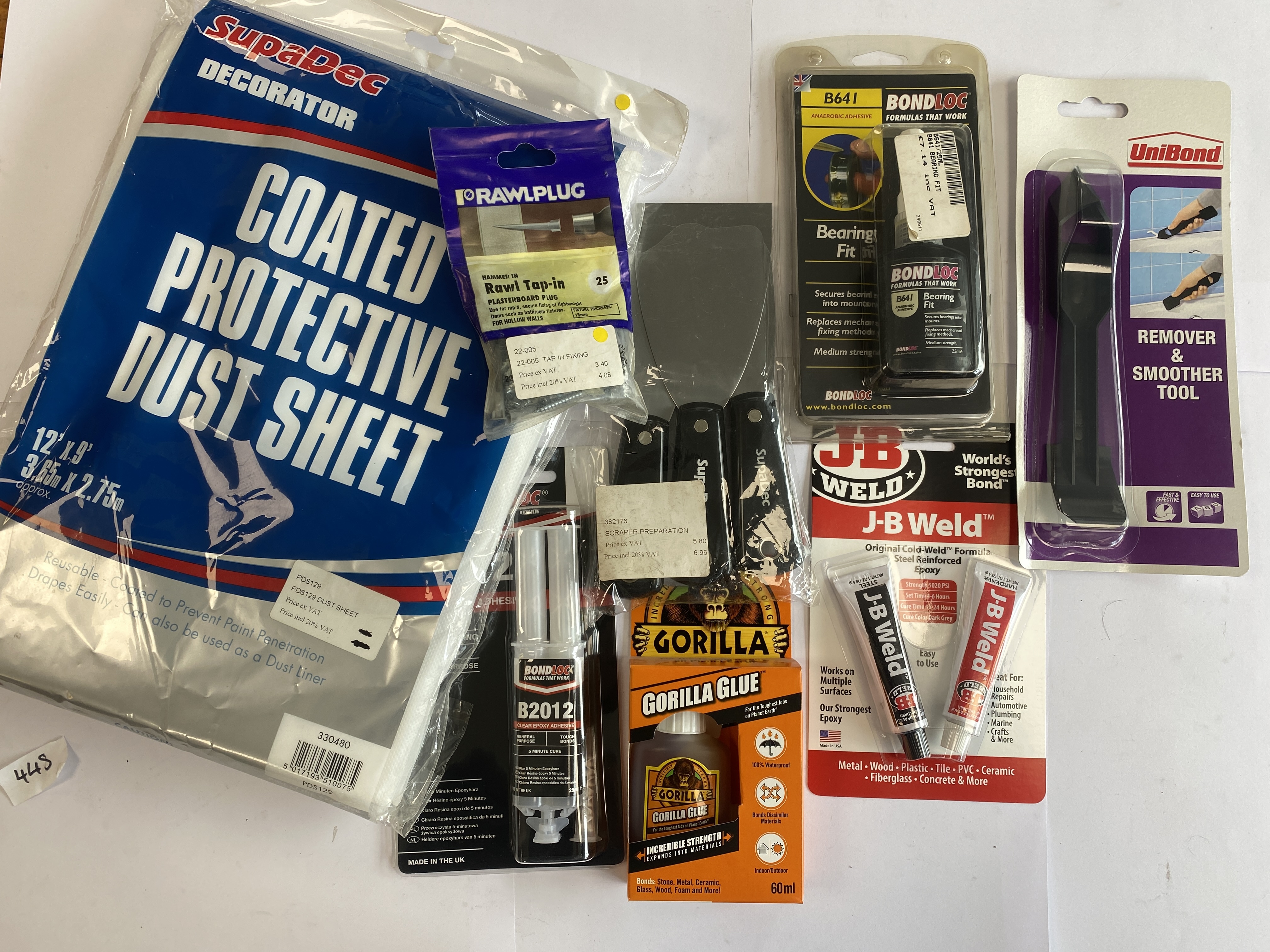 * An Assortment of Home Improvement and Decorating Supplies Including Gorilla Glue and J-B Weld