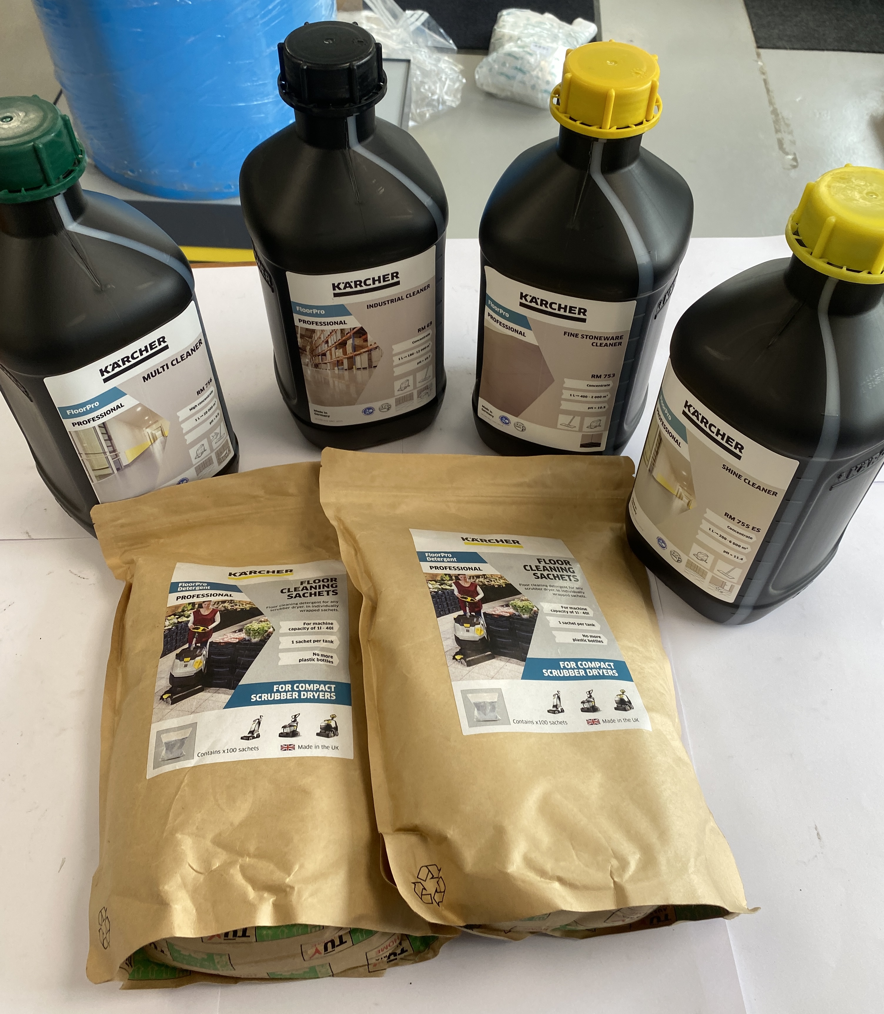 * A Group of Kärcher Professional Floor Cleaning Detergents Including Four 1L Bottles and Two 100-Count Sachet Bags
