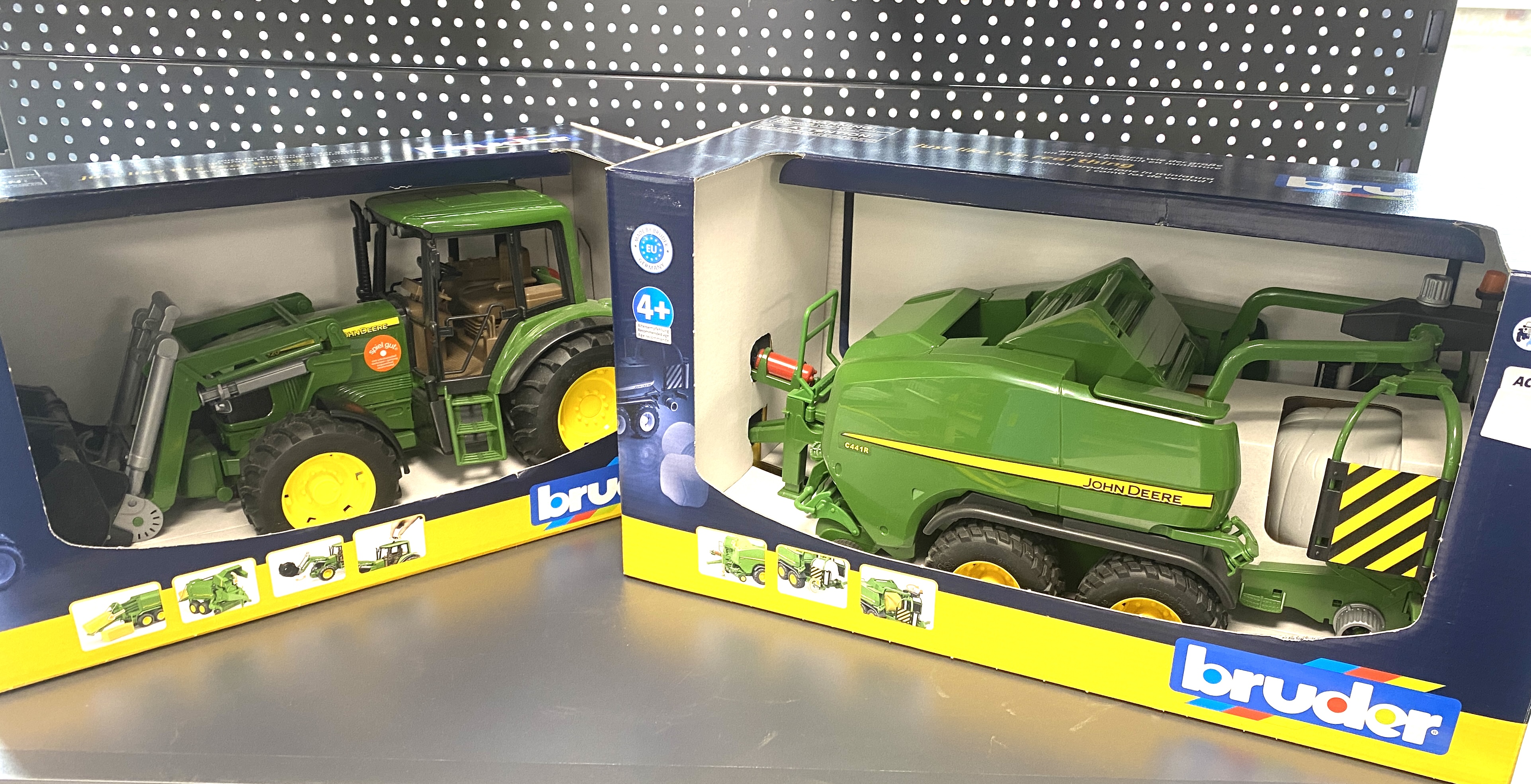 * A Pair of Bruder John Deere Scale Model Farm Vehicles in Original Packaging