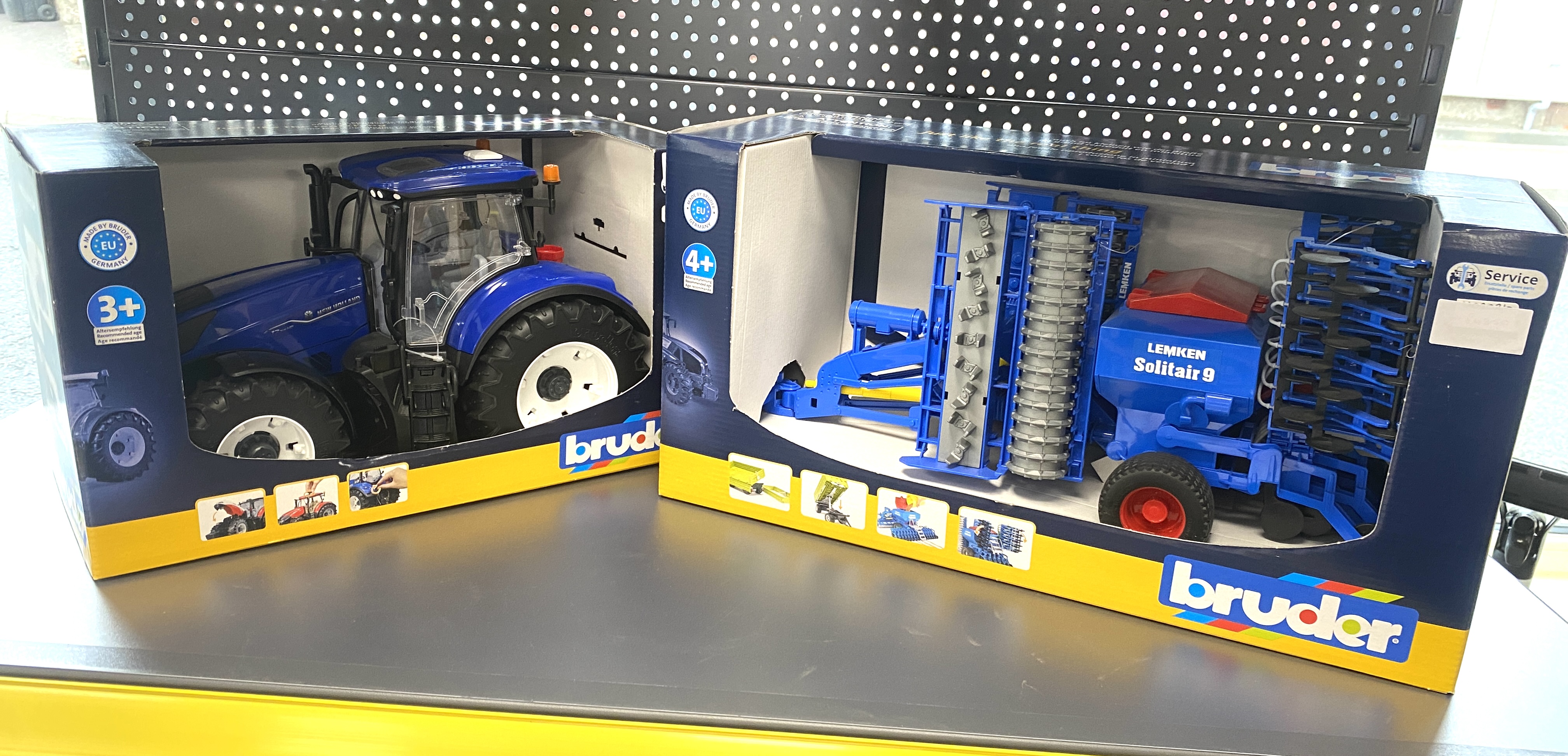 * A Pair of Bruder 1:16 Scale Agricultural Toy Models Including New Holland Tractor and Lemken Solitair 9 Sowing Combination