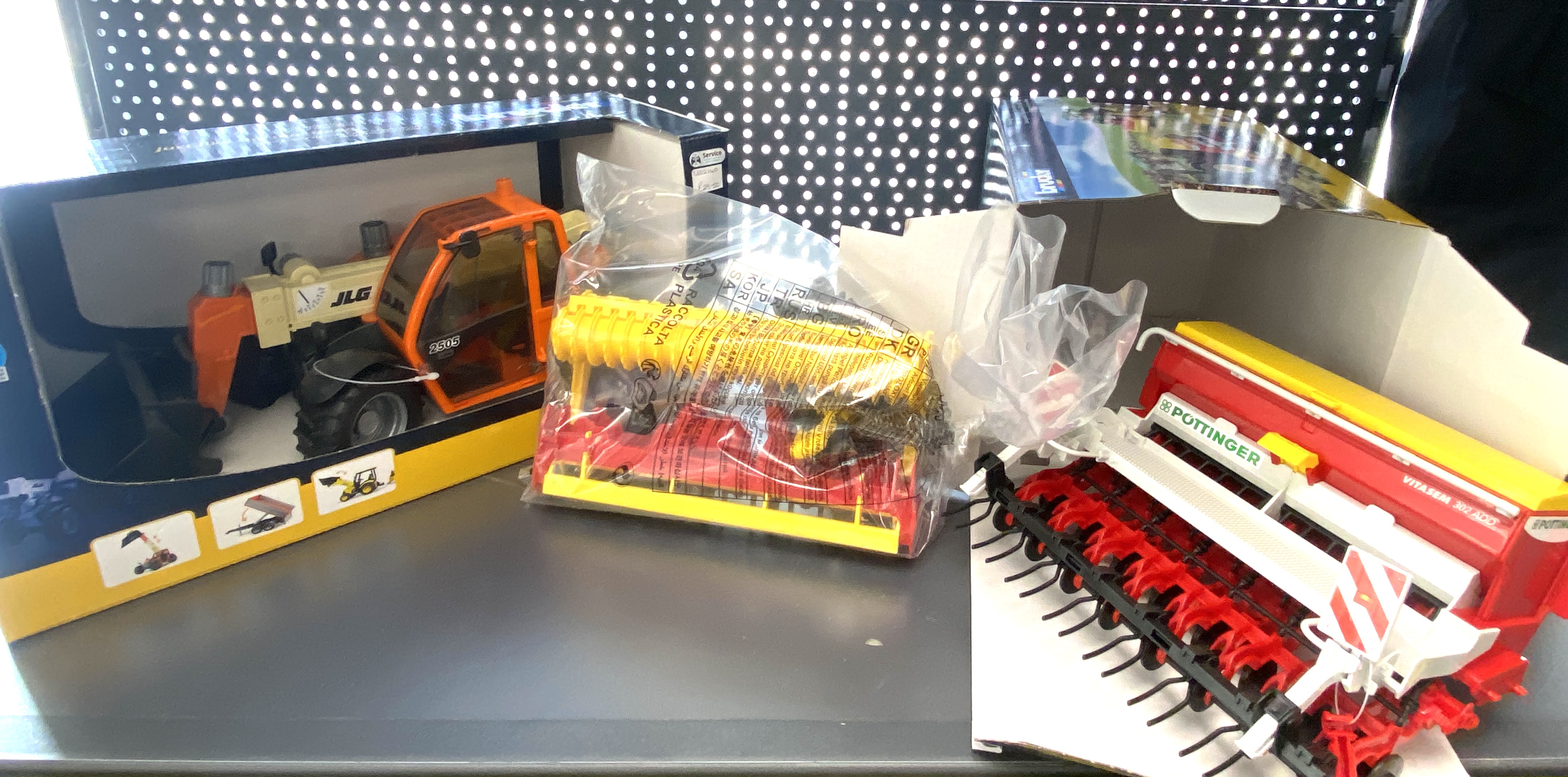 * Three Bruder Professional Series Scale Models Including JLG Telehandler and Poettinger Seed Drill