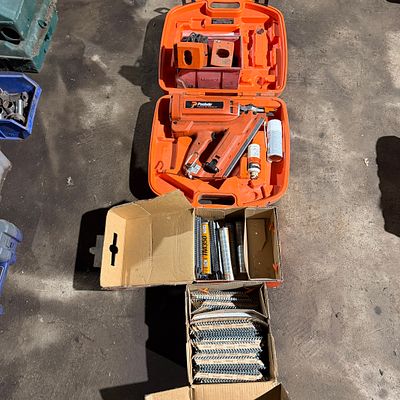 *. A Paslode nail gun and nails battery charger spares