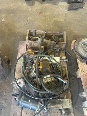 *. Pallet of hydraulic pumps and starter and pipes