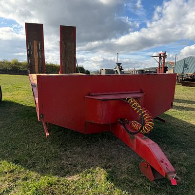 *. A 25 foot long x 8.5 foot wide plant shipping trailer. Hydraulic back doors