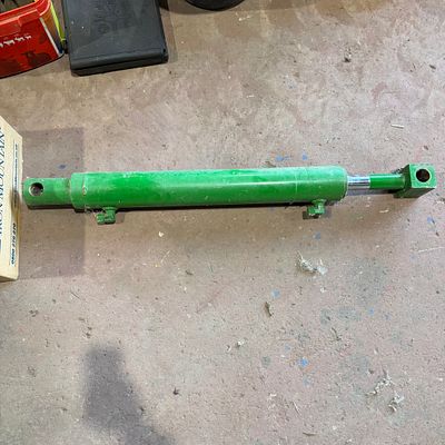 *. A John Deere loading ram