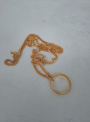 Hallmarked 22ct gold wedding ring on an unmarked gold chain, Ring approx 3 grams, total weight 