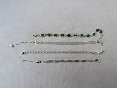Four silver stamped bracelets, weight 21.7 grams