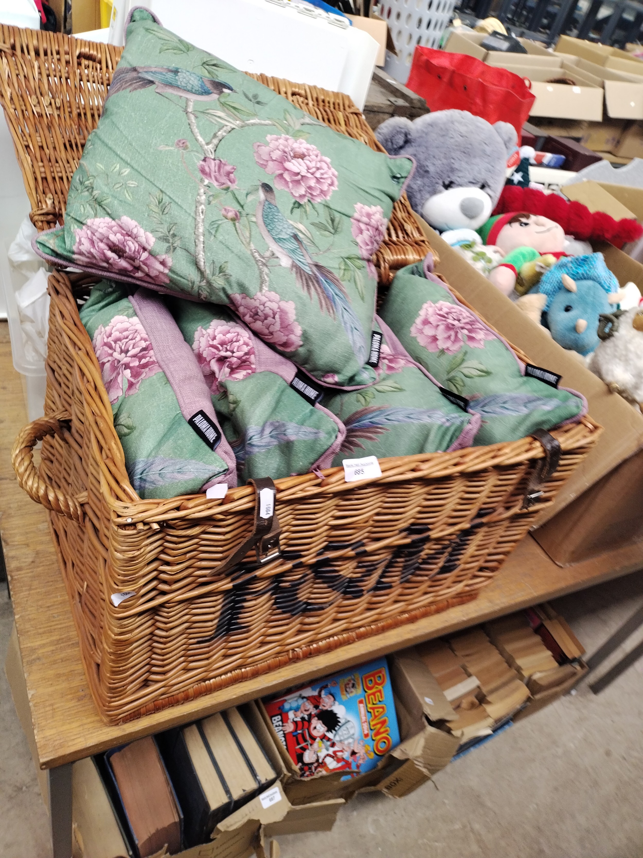 Wicker basket containing matching cushions
