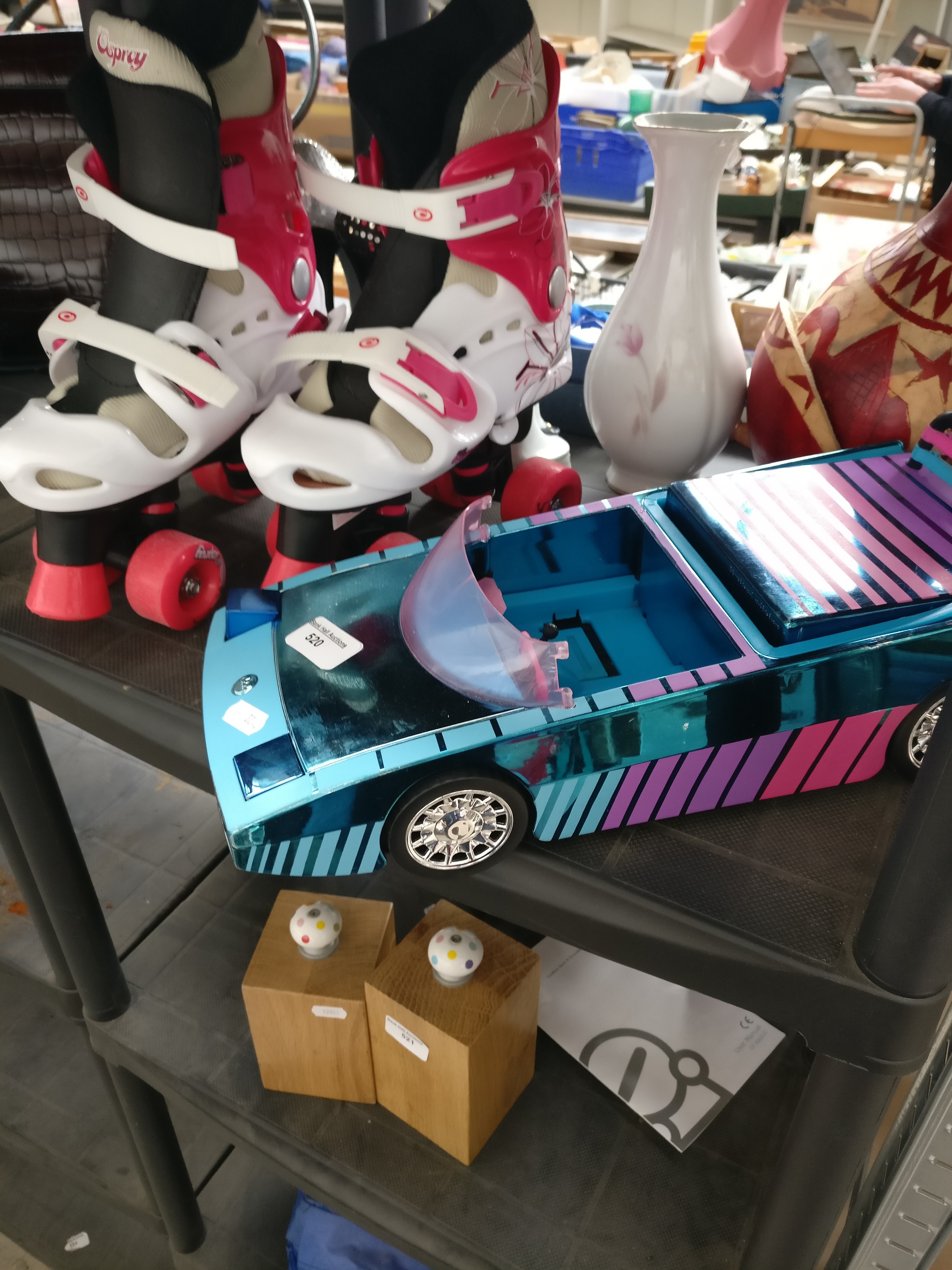 Pair of roller skates and car